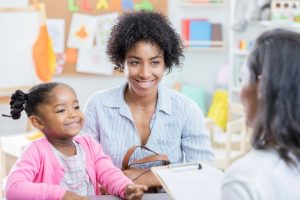 parent-teacher-meeting-discussing-child-reading